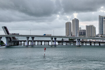 Canvas Print - Beautiful skyline of Miami at sunrise with Sea and Tall Skyscrapers