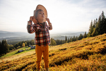 Wall Mural - .Boy hiker resting in the mountains in autumn