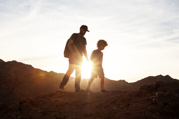 Wall Mural - Dad with son in the mountains in the desert
