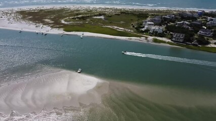 Wall Mural - boat heading out to sea at the inlet