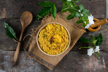 Bengali dish khichdi or khichuri made from a combination of lentils and rice along with Indian spices. Ready to eat food. Close up.