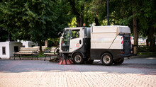 Compact Small Washing Machine In The  City Street, Municipal Sweeper