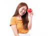 © suphaporn - Portrait of smiling a beautiful Asian young woman holding red heart in hand on white background- Valentine day concept