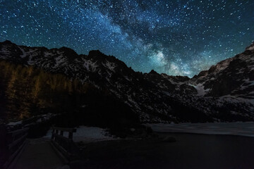 Wall Mural - bright starry sky with the milky way on the background of high tatras mountains