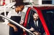 © prostooleh - Stylish black woman in a car salon