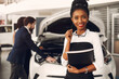© prostooleh - Two stylish black woman in a car salon
