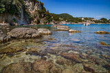 Fototapeta Łazienka - Transparent water of the sea near the coast of Corfu, Greece.
