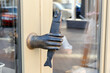 The hand holds the fish. Doorhandle. Large.