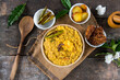 Dal khichadi or khichdi a delicious Indian recipe made of yellow dal or lentils and rice . Selective focus. It is generally accompanied with fried vegetables.