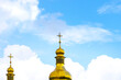 Gold domes of Christian churches. House of prayer. religion concept, faith in god. Domes with crosses against the background of the beautiful sky with clouds.
