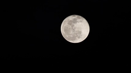 Wall Mural - Clouds drifting across the sky. scary full moon in the dark
