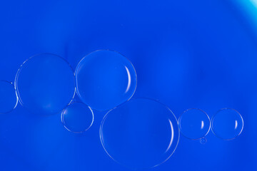 Abstract Macro Photography of a bubble on a blue colour water mixed with blue food color mix. Macro bubble photography.