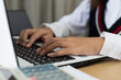 © Sam - Hands closeup working with computer laptop, unrecognizable person typing. Conceptual business, home office horizontal shot.