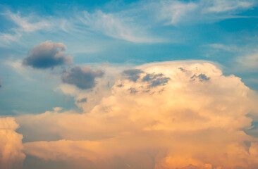 Wall Mural - stormy sky with dramatic clouds from an approaching thunderstorm at sunset.big red storm cloud in su