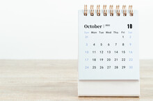 October Calendar 2021 On Wooden Table.