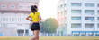 © EduLife Photos - A young Asian woman athlete runner jogging on running track in city stadium in the sunny morning to keep fitness and healthy lifestyle. Young fitness woman runs on stadium track. Sport and recreation