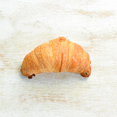 Wall Mural - Fresh French croissants with chocolate. Baking from rye and flour. Top view. Rustic style.