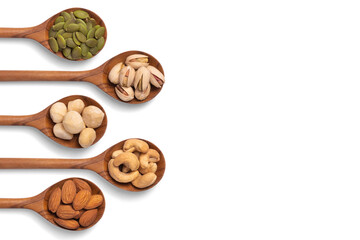 many snack nuts pumpkin seeds, pistachios, macadamia nuts, cashew nut, almond in wooden spoon on white background. Vegetarian or vegan snake. Healthy food eating. Top view