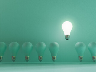 Poster - One lightbulb shining and rising above on others bulbs on blue background for outstanding ,different creative thinking idea and innovation concept by 3d render.