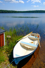 Rowing Boat At Lake Bredsjön In The Swedish Nature Reserve Hökensas