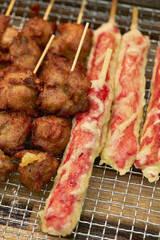 Poster - Chicken and tempura displayed in a traditional market