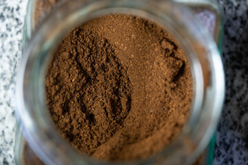 Sticker - A top view of an open jar of instant coffee