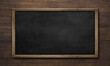 Black nameplate at wooden background texture, on plank board wall. 3d illustration