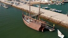 Lagos Algarve Portugal Portuguese Wooden Caravela. Aerial Drone View Rising Up Above Harbor, Day