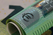 © marek_usz - Euro banknote rolled into a roll, currency symbol
