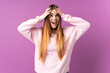 © luismolinero - Young caucasian woman isolated on purple background with surprise expression