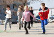 © JackF - Group of joyful children running down the city street. High quality photo