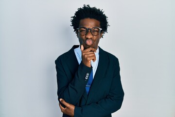 Poster - Young african american man wearing business suit and tie looking at the camera blowing a kiss being lovely and sexy. love expression.