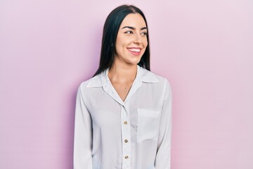 Sticker - Beautiful woman with blue eyes wearing casual white shirt looking away to side with smile on face, natural expression. laughing confident.