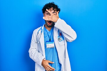 Poster - Young hispanic man wearing doctor uniform and stethoscope thinking looking tired and bored with depression problems with crossed arms.