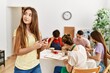 © Krakenimages.com - Group of people smiling happy drawing at art studio.