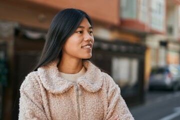 Sticker - Young asian woman smiling happy standing at the city.