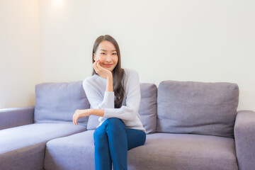 Wall Mural - Portrait beautiful young asian woman relax smile on sofa