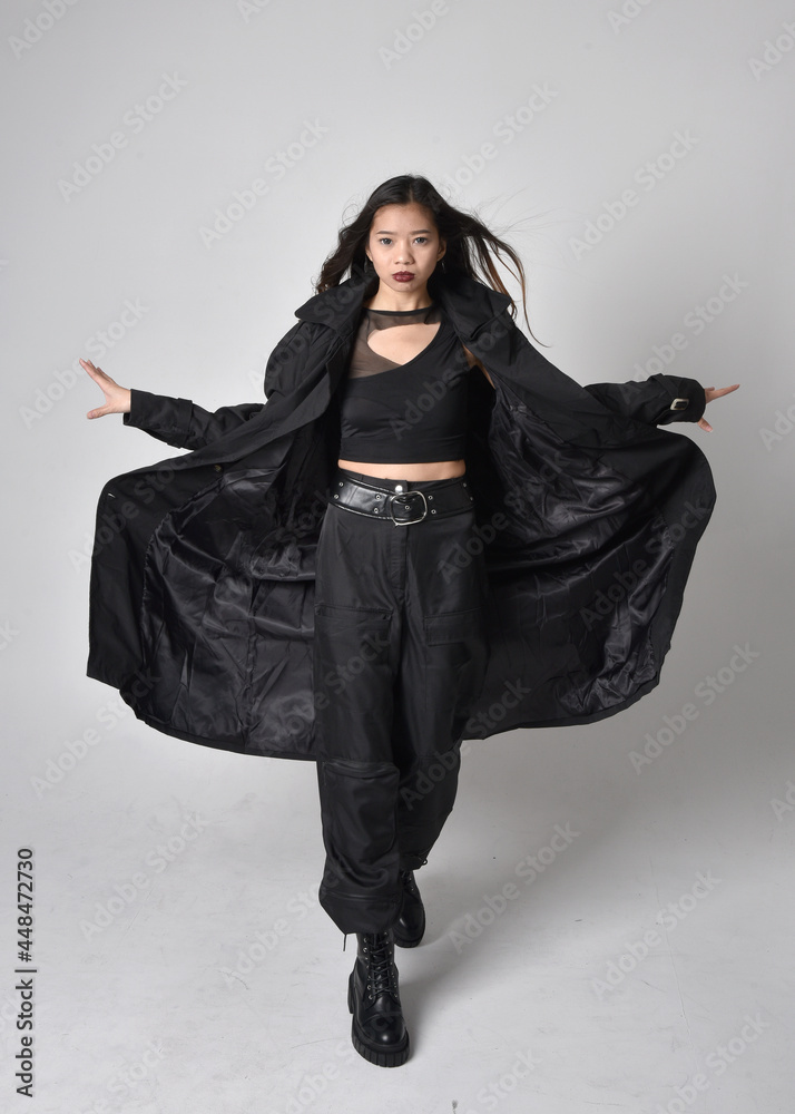 Full length portrait of pretty young asian girl wearing black tank top ...