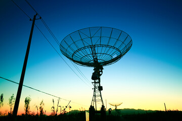 Wall Mural - the silhouette of a radio telescope observatory