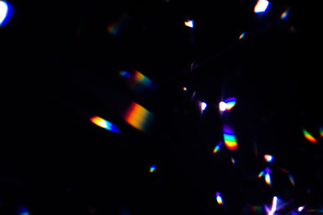 Blur colorful warm rainbow crystal light leaks on black background. Defocused abstract retro film analog effect for using over photos as overlay or screen filter