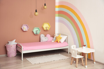 Sticker - Cute child's room interior with beautiful rainbow painted on wall