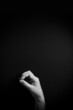 © GrumpyLivesHere - B&W image of hand demonstrating ASL sign language letter O with empty copy space