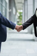 © DragonImages - Close-up image of senior entrepreneurs shaking hands to confirm deal after successful meeting