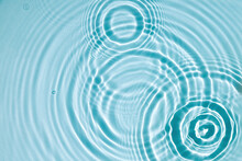 Blue Water Texture, Blue Mint Water Surface With Rings And Ripples. Spa Concept Background. Flat Lay, Copy Space.