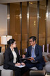 © DragonImages - Positive senior managers meeting to discuss data in reports and sign documents