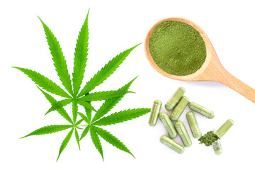 Wall Mural - cannabis leaf  and hemp powder capsule isolated on white