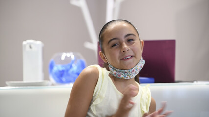 Sticker - Confident young caucasian girl smiling to the camera in a modern recording studio