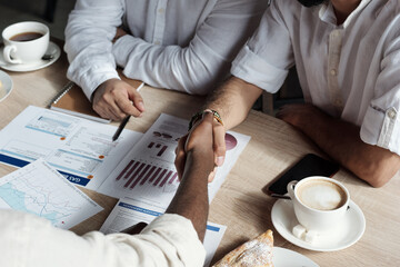 Aufkleber - Two Arabic businessmen shaking hands over table while making agreement
