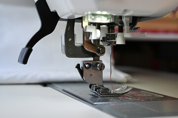 Wall Mural - Closeup of a sewing machine ready for using. Tailoring concept.