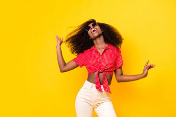 Wall Mural - Photo of charming nice dark skin lady wear sunglass dance summer isolated on shine yellow color background